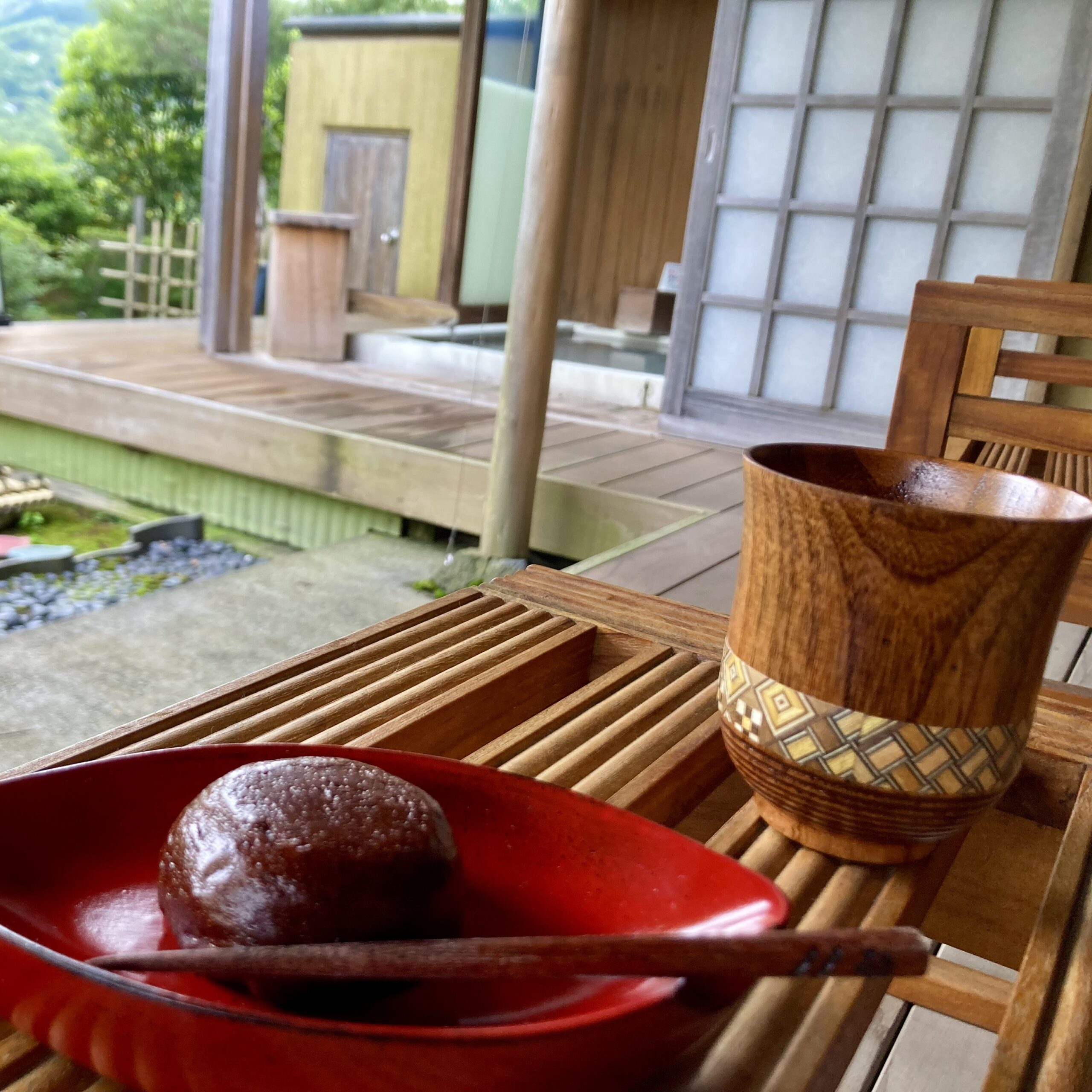 Japanese tea and sweet on wooden tray in calm setting